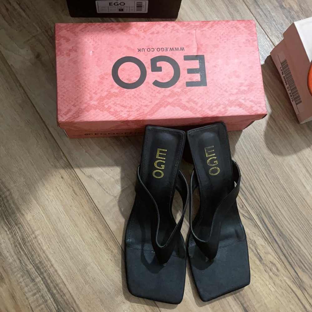 Ego brand “ heel less” thong sandals.